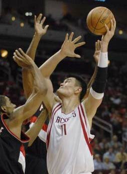 Houston Rockets' Yao Ming (11), of China, shoots over Portland Trail Blazers' LaMarcus Aldridge in the fourth quarter of their NBA basketball game in Houston November 3, 2007.